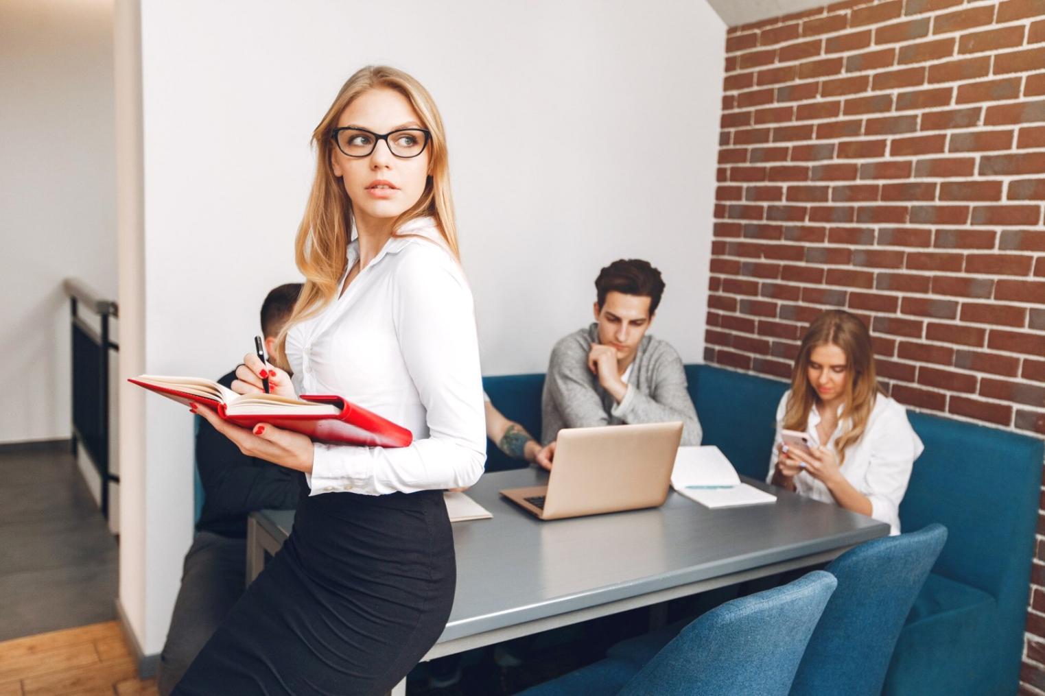 Person reviewing financial charts and weekly expense tracking