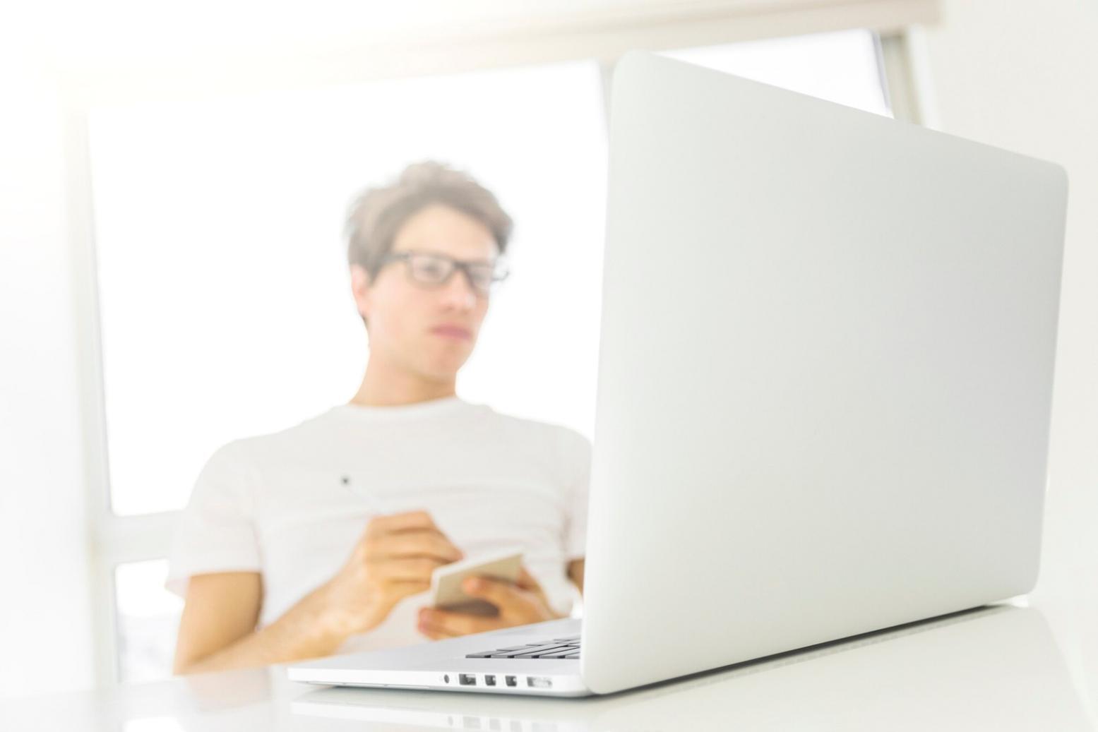 Financial planning workspace with laptop and budget documents